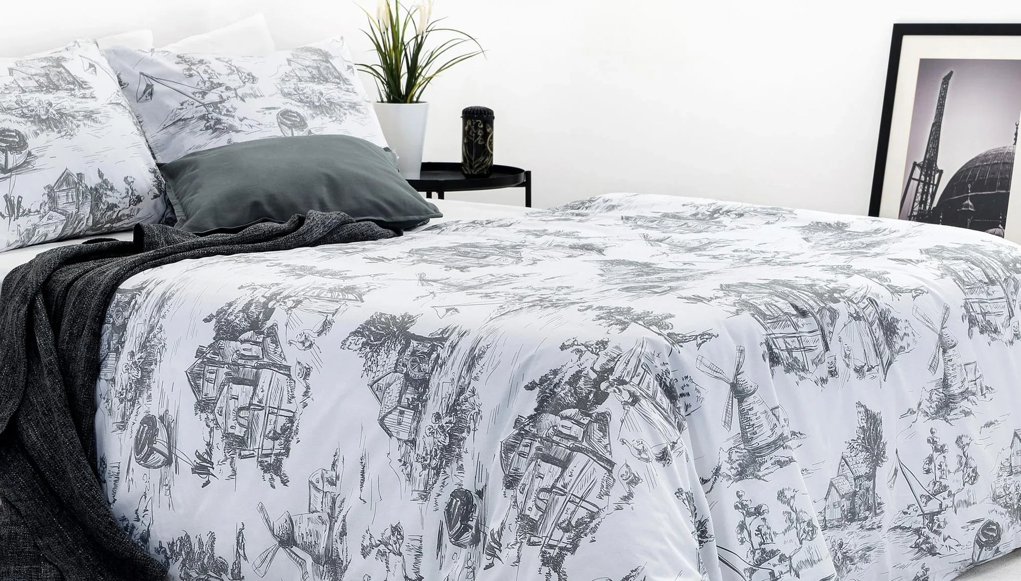 Graphic print bedding set with black and white illustrated pattern in modern bedroom